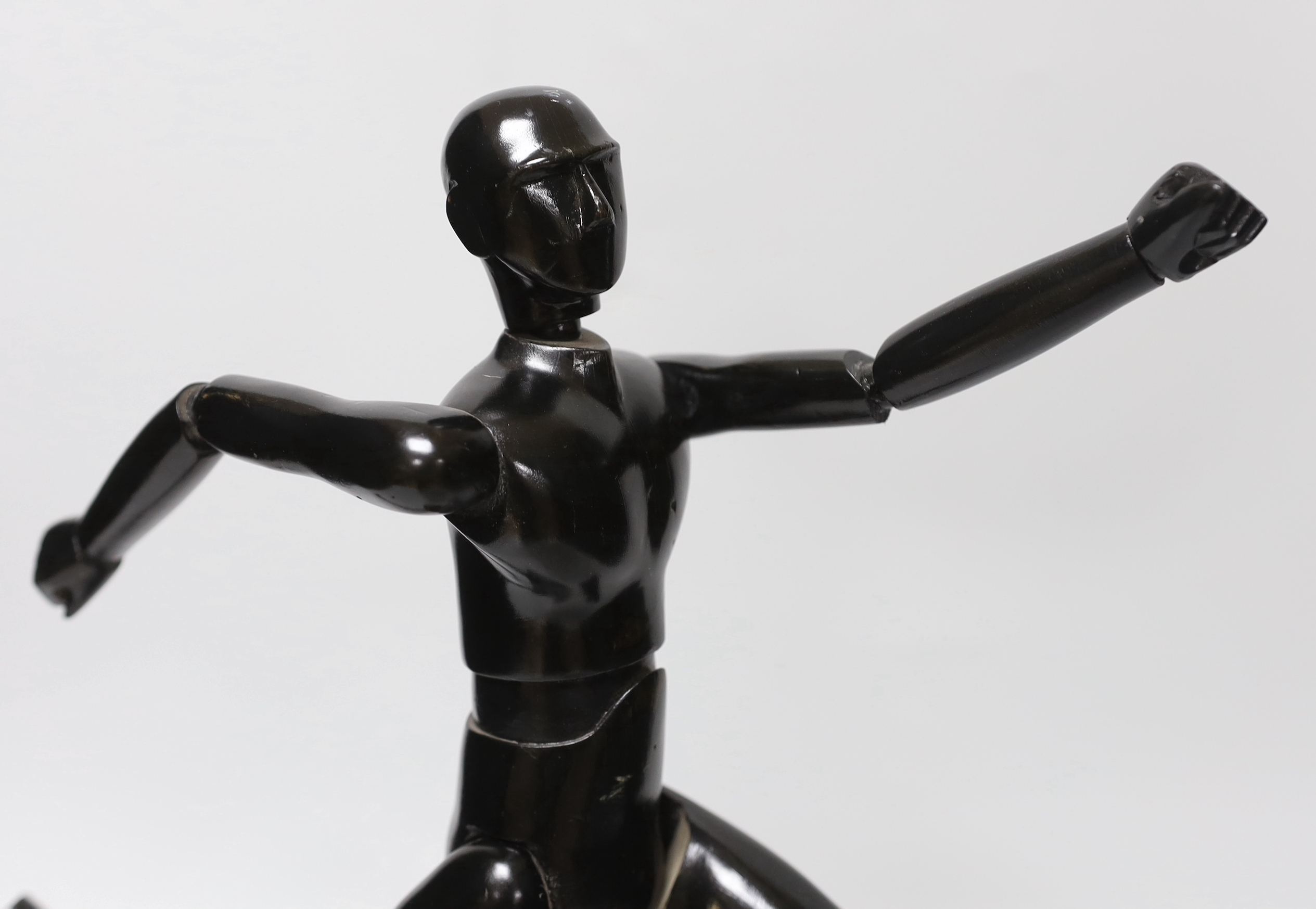 A carved wood lay figure on stand, 38cm